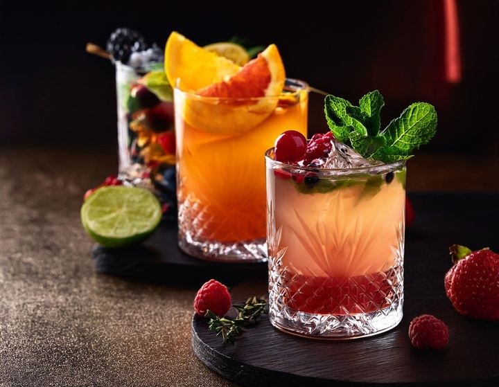 Colorful alcohol-free cocktails garnished with citrus, mint and berries at Sans Bar in Austin, Texas