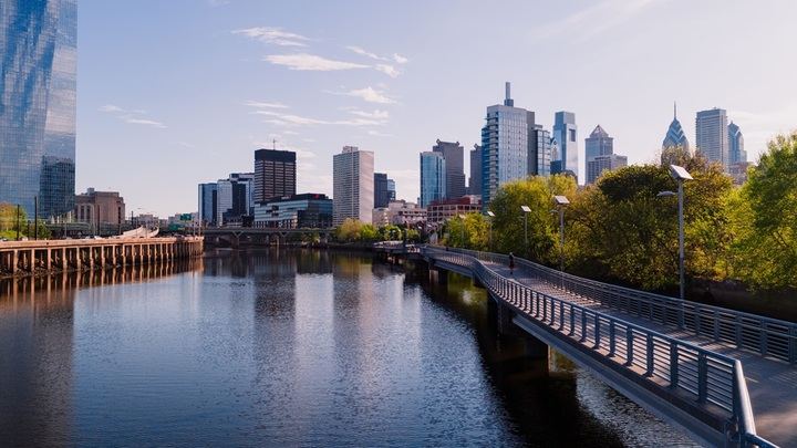 Schuylkill River Boardwalk curving toward the Philadelphia skyline near Hidden River Outfitters' kayak launch
